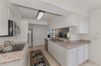 Charming 3-bedroom, 2-bathroom, canal-front home in the highly on Pinemoor West Golf Club in Florida - for sale on GolfHomes.com, golf home, golf lot