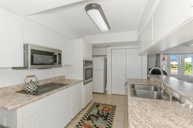 Charming 3-bedroom, 2-bathroom, canal-front home in the highly on Pinemoor West Golf Club in Florida - for sale on GolfHomes.com, golf home, golf lot