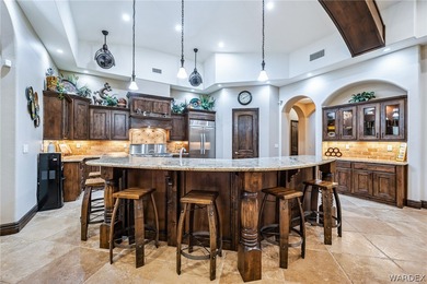 Nearly 6,000 Sq Ft of Purposeful Luxury with Dual Primary Suites on Laughlin Ranch Golf Club in Arizona - for sale on GolfHomes.com, golf home, golf lot