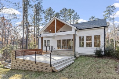 This modern farmhouse is a dream for anyone who loves both style on The Preserve At Jordan Lake Golf Club in North Carolina - for sale on GolfHomes.com, golf home, golf lot