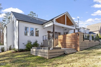 This modern farmhouse is a dream for anyone who loves both style on The Preserve At Jordan Lake Golf Club in North Carolina - for sale on GolfHomes.com, golf home, golf lot