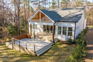 This modern farmhouse is a dream for anyone who loves both style on The Preserve At Jordan Lake Golf Club in North Carolina - for sale on GolfHomes.com, golf home, golf lot