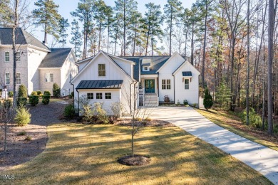 This modern farmhouse is a dream for anyone who loves both style on The Preserve At Jordan Lake Golf Club in North Carolina - for sale on GolfHomes.com, golf home, golf lot