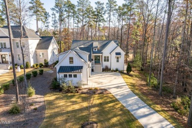 This modern farmhouse is a dream for anyone who loves both style on The Preserve At Jordan Lake Golf Club in North Carolina - for sale on GolfHomes.com, golf home, golf lot