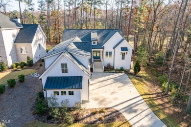 This modern farmhouse is a dream for anyone who loves both style on The Preserve At Jordan Lake Golf Club in North Carolina - for sale on GolfHomes.com, golf home, golf lot