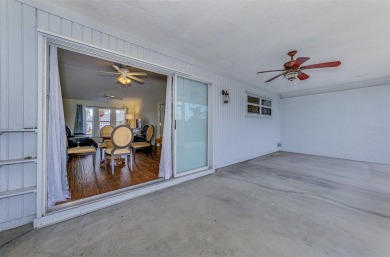 Charming 3-bedroom, 2-bathroom, canal-front home in the highly on Pinemoor West Golf Club in Florida - for sale on GolfHomes.com, golf home, golf lot