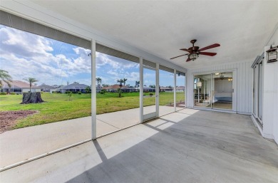 Charming 3-bedroom, 2-bathroom, canal-front home in the highly on Pinemoor West Golf Club in Florida - for sale on GolfHomes.com, golf home, golf lot