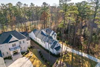 This modern farmhouse is a dream for anyone who loves both style on The Preserve At Jordan Lake Golf Club in North Carolina - for sale on GolfHomes.com, golf home, golf lot