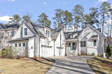 This modern farmhouse is a dream for anyone who loves both style on The Preserve At Jordan Lake Golf Club in North Carolina - for sale on GolfHomes.com, golf home, golf lot