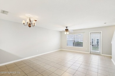 Enjoy low-maintenance living in this two-story townhome located on Golf Club At Fleming Island in Florida - for sale on GolfHomes.com, golf home, golf lot