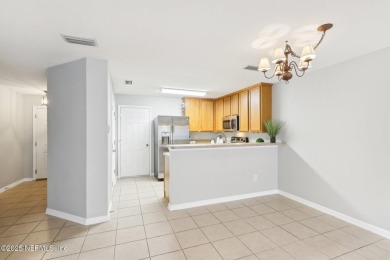 Enjoy low-maintenance living in this two-story townhome located on Golf Club At Fleming Island in Florida - for sale on GolfHomes.com, golf home, golf lot