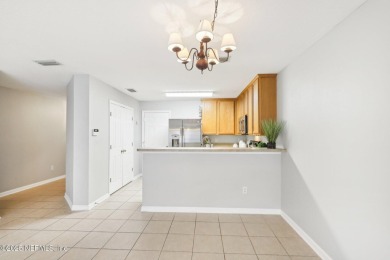 Enjoy low-maintenance living in this two-story townhome located on Golf Club At Fleming Island in Florida - for sale on GolfHomes.com, golf home, golf lot