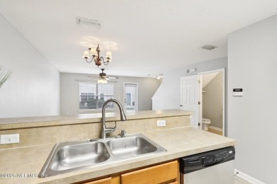 Enjoy low-maintenance living in this two-story townhome located on Golf Club At Fleming Island in Florida - for sale on GolfHomes.com, golf home, golf lot