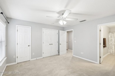 Enjoy low-maintenance living in this two-story townhome located on Golf Club At Fleming Island in Florida - for sale on GolfHomes.com, golf home, golf lot