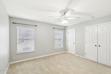 Enjoy low-maintenance living in this two-story townhome located on Golf Club At Fleming Island in Florida - for sale on GolfHomes.com, golf home, golf lot