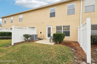 Enjoy low-maintenance living in this two-story townhome located on Golf Club At Fleming Island in Florida - for sale on GolfHomes.com, golf home, golf lot