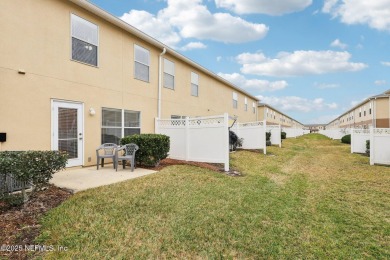 Enjoy low-maintenance living in this two-story townhome located on Golf Club At Fleming Island in Florida - for sale on GolfHomes.com, golf home, golf lot