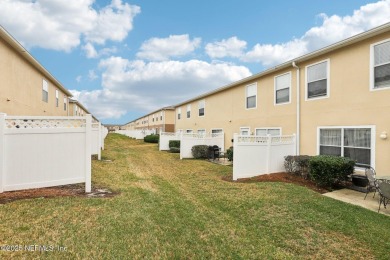 Enjoy low-maintenance living in this two-story townhome located on Golf Club At Fleming Island in Florida - for sale on GolfHomes.com, golf home, golf lot