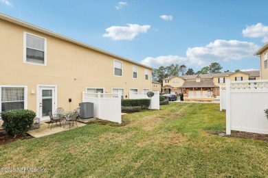 Enjoy low-maintenance living in this two-story townhome located on Golf Club At Fleming Island in Florida - for sale on GolfHomes.com, golf home, golf lot