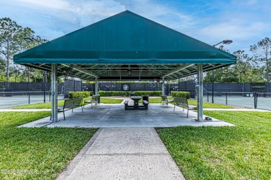 Enjoy low-maintenance living in this two-story townhome located on Golf Club At Fleming Island in Florida - for sale on GolfHomes.com, golf home, golf lot