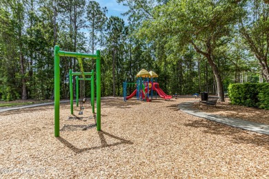 Enjoy low-maintenance living in this two-story townhome located on Golf Club At Fleming Island in Florida - for sale on GolfHomes.com, golf home, golf lot