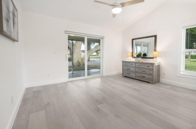 This gorgeous golf-view home has been totally renovated in 2024 on The Golf Club of Jupiter in Florida - for sale on GolfHomes.com, golf home, golf lot