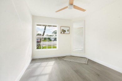 This gorgeous golf-view home has been totally renovated in 2024 on The Golf Club of Jupiter in Florida - for sale on GolfHomes.com, golf home, golf lot