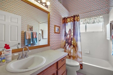 This spacious 3-bedroom, 2-bathroom home with a 2-car garage on Plantation Golf Club in Florida - for sale on GolfHomes.com, golf home, golf lot