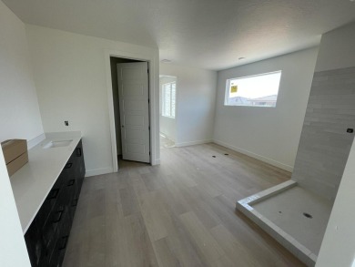 Nestled just two minutes from Sunbrook Golf Course, this elegant on Sunbrook Golf Course in Utah - for sale on GolfHomes.com, golf home, golf lot