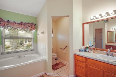 This spacious 3-bedroom, 2-bathroom home with a 2-car garage on Plantation Golf Club in Florida - for sale on GolfHomes.com, golf home, golf lot