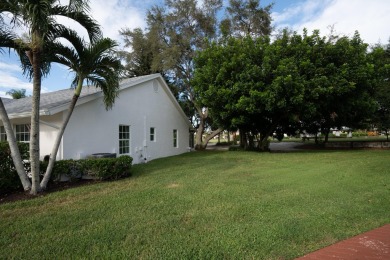 This gorgeous golf-view home has been totally renovated in 2024 on The Golf Club of Jupiter in Florida - for sale on GolfHomes.com, golf home, golf lot