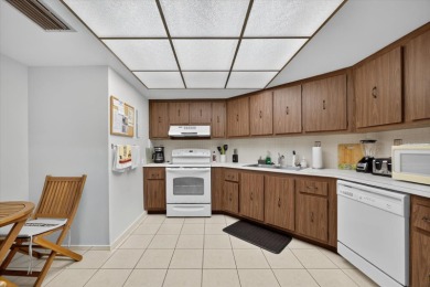 Live the Florida dream in this beautiful waterfront condo on on Isla Del Sol Yacht and Country Club in Florida - for sale on GolfHomes.com, golf home, golf lot