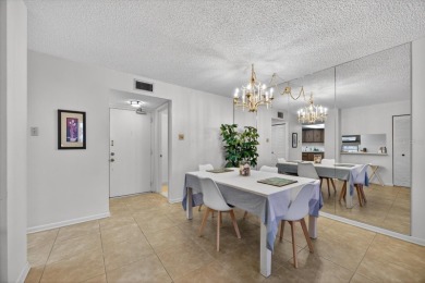 Live the Florida dream in this beautiful waterfront condo on on Isla Del Sol Yacht and Country Club in Florida - for sale on GolfHomes.com, golf home, golf lot