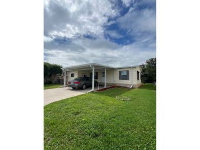 Charming Updated and Modern home with privacy and stunning water on Lake Henry Golf Club in Florida - for sale on GolfHomes.com, golf home, golf lot