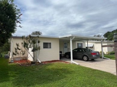 Charming Updated and Modern home with privacy and stunning water on Lake Henry Golf Club in Florida - for sale on GolfHomes.com, golf home, golf lot