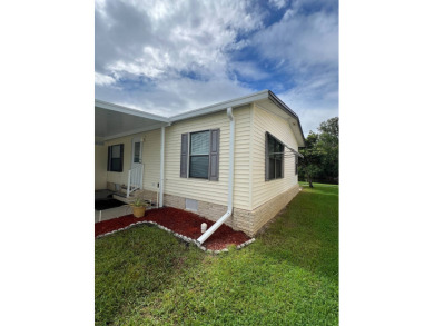 Charming Updated and Modern home with privacy and stunning water on Lake Henry Golf Club in Florida - for sale on GolfHomes.com, golf home, golf lot