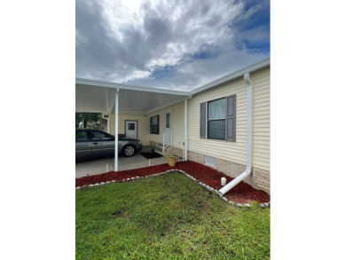 Charming Updated and Modern home with privacy and stunning water on Lake Henry Golf Club in Florida - for sale on GolfHomes.com, golf home, golf lot