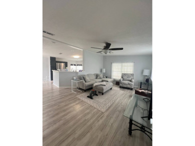 Charming Updated and Modern home with privacy and stunning water on Lake Henry Golf Club in Florida - for sale on GolfHomes.com, golf home, golf lot