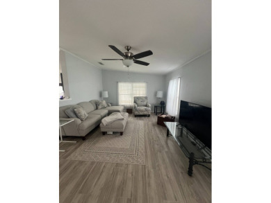 Charming Updated and Modern home with privacy and stunning water on Lake Henry Golf Club in Florida - for sale on GolfHomes.com, golf home, golf lot