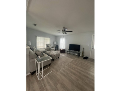 Charming Updated and Modern home with privacy and stunning water on Lake Henry Golf Club in Florida - for sale on GolfHomes.com, golf home, golf lot