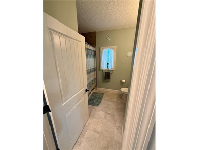 Experience relaxed coastal living in this updated 3-bedroom on Ocean Palm Golf Course in Florida - for sale on GolfHomes.com, golf home, golf lot