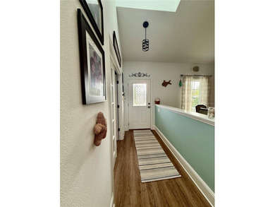 Experience relaxed coastal living in this updated 3-bedroom on Ocean Palm Golf Course in Florida - for sale on GolfHomes.com, golf home, golf lot