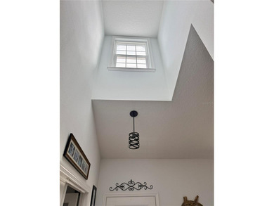 Experience relaxed coastal living in this updated 3-bedroom on Ocean Palm Golf Course in Florida - for sale on GolfHomes.com, golf home, golf lot