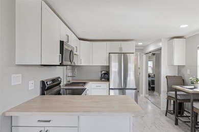 Welcome to this beautifully remodeled, energy-efficient home on Polo Park East in Florida - for sale on GolfHomes.com, golf home, golf lot