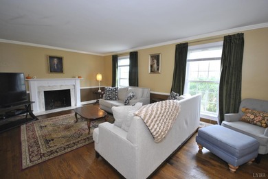 Enjoy mountain views from the front of this traditional on Ivy Hill Golf Club in Virginia - for sale on GolfHomes.com, golf home, golf lot