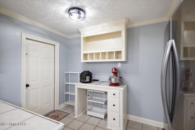 This charming 3-bedroom, 2-bath home, nestled in the heart of on Pearl Municipal Golf Course in Mississippi - for sale on GolfHomes.com, golf home, golf lot