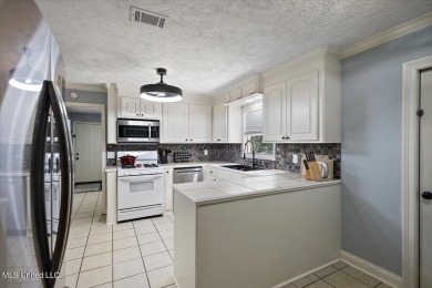 This charming 3-bedroom, 2-bath home, nestled in the heart of on Pearl Municipal Golf Course in Mississippi - for sale on GolfHomes.com, golf home, golf lot