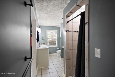 This charming 3-bedroom, 2-bath home, nestled in the heart of on Pearl Municipal Golf Course in Mississippi - for sale on GolfHomes.com, golf home, golf lot