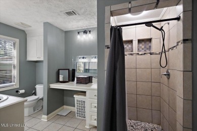 This charming 3-bedroom, 2-bath home, nestled in the heart of on Pearl Municipal Golf Course in Mississippi - for sale on GolfHomes.com, golf home, golf lot