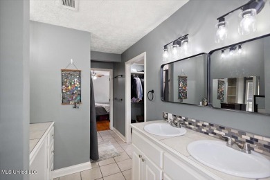 This charming 3-bedroom, 2-bath home, nestled in the heart of on Pearl Municipal Golf Course in Mississippi - for sale on GolfHomes.com, golf home, golf lot